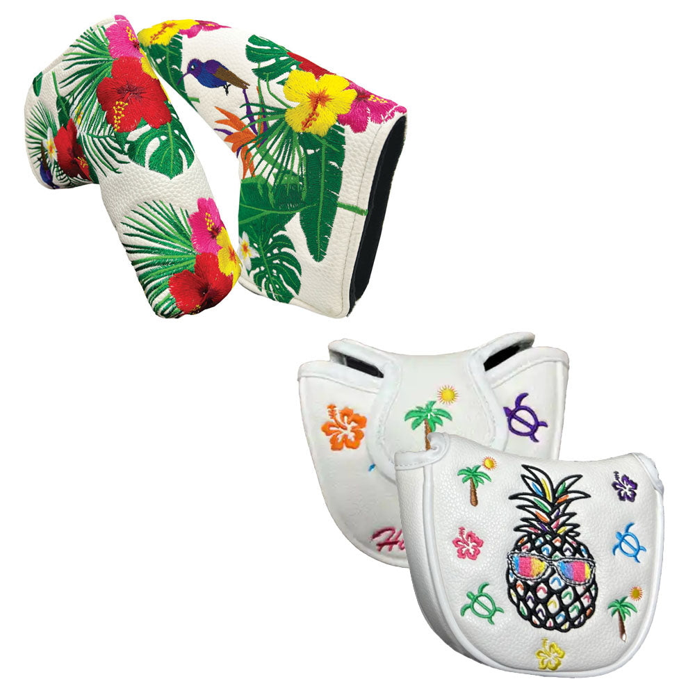 Two tropical-themed custom golf putter covers, mallet and blade style, with embroidered hibiscus flowers, palm trees, turtles, and a pineapple with sunglasses.