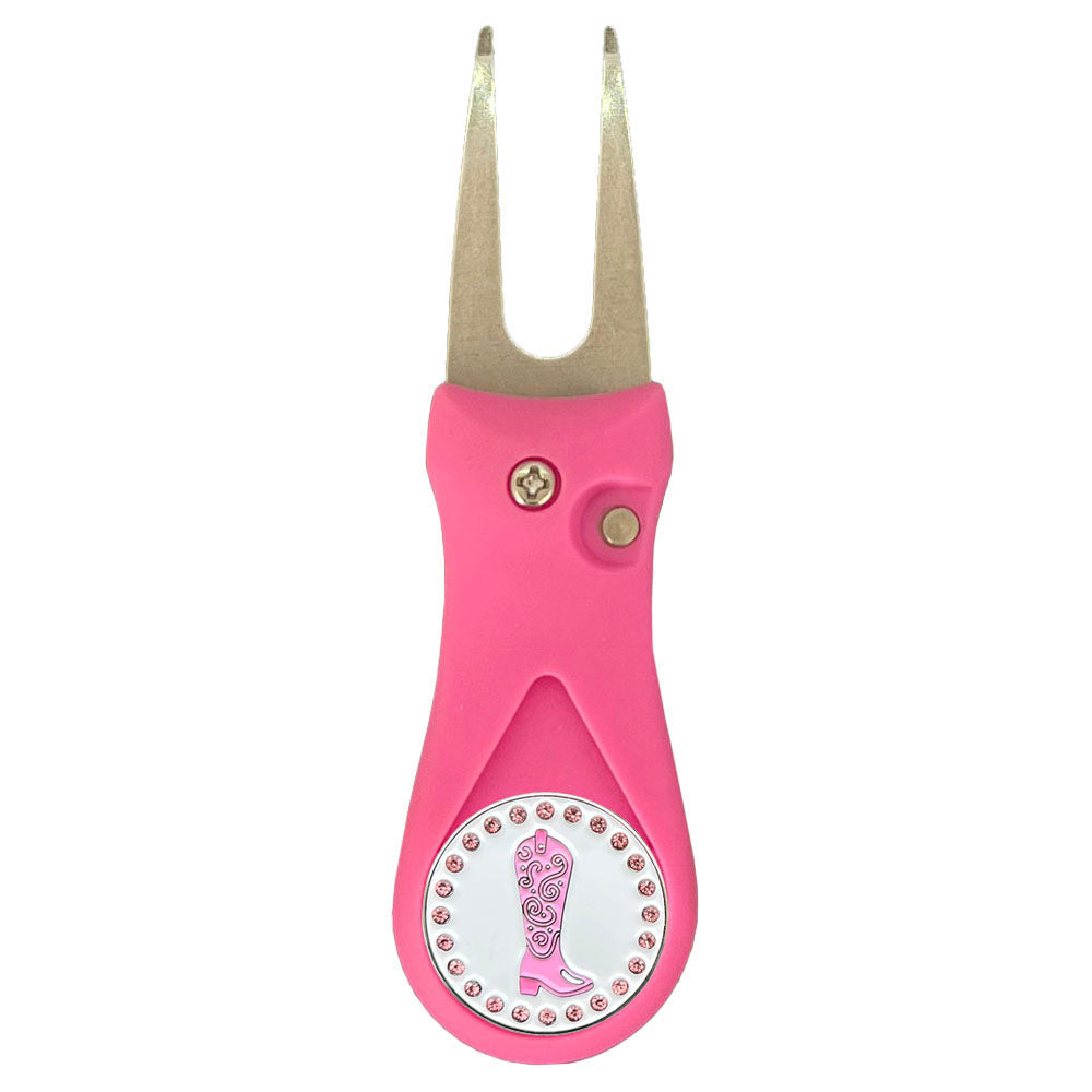 Pink golf divot tool with a cowgirl boot design on a white background