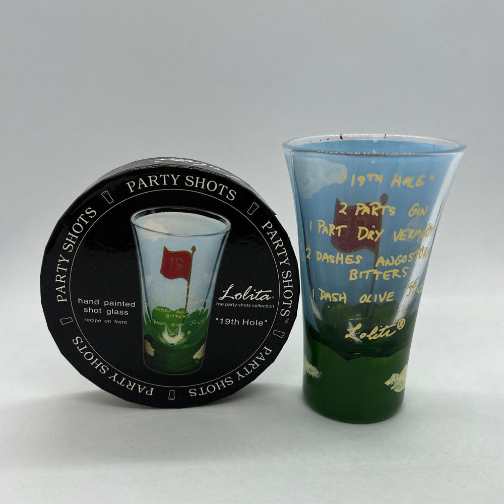 Hand-painted Lolita 2 oz shot glass with golf flag design and '19th Hole' text