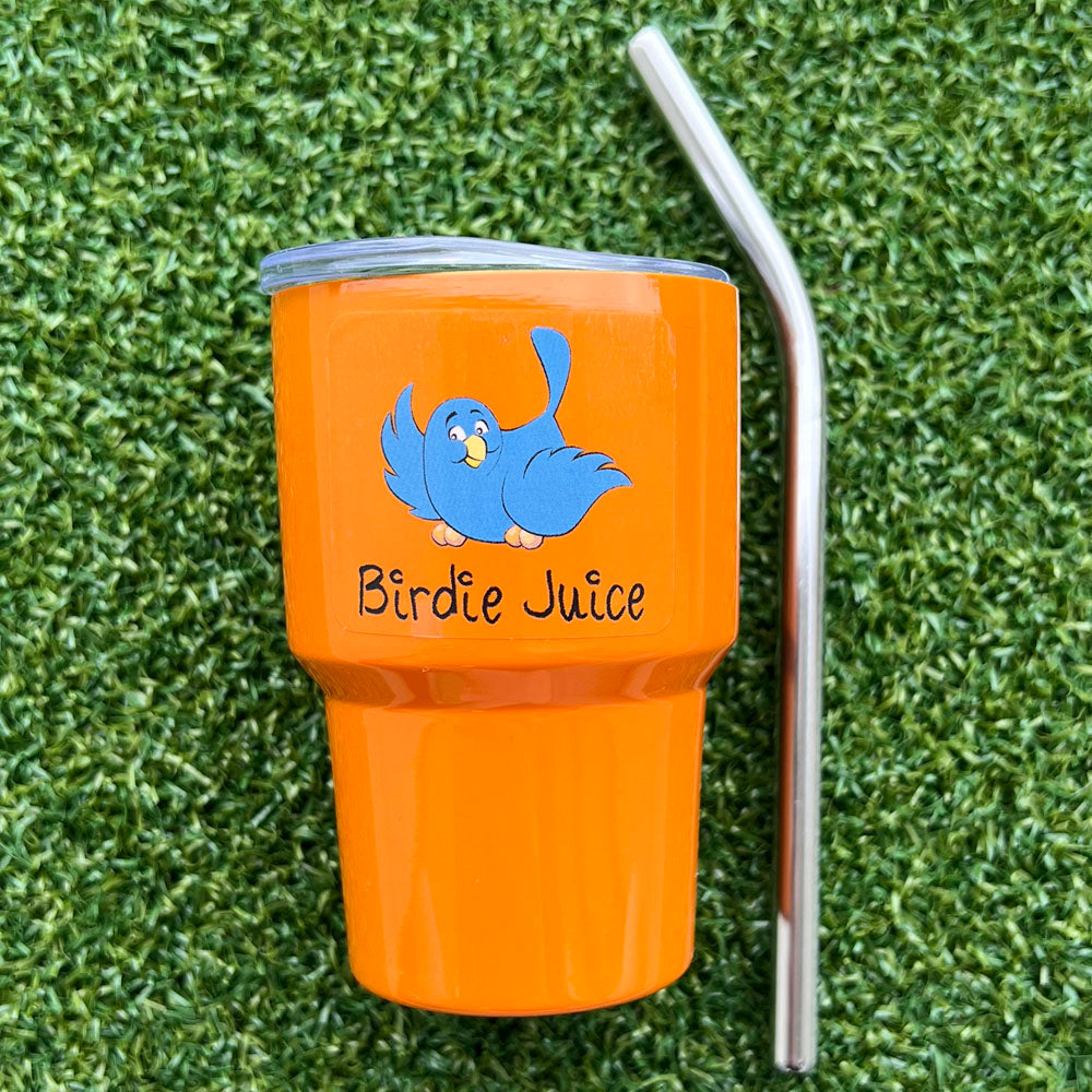 Orange golf mini tumbler with blue bird design and 'Birdie Juice' text on grass - bright set