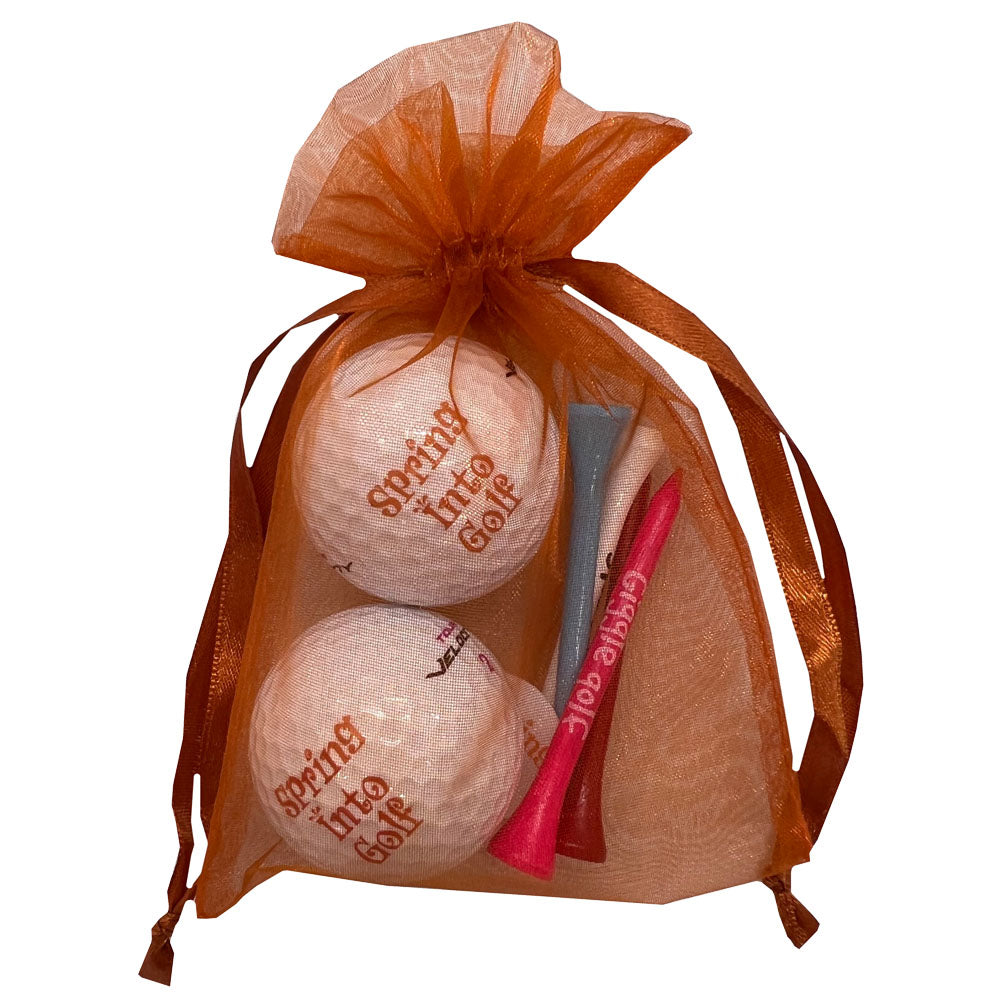 Spring Into Golf ball and tees set. Cute Packaging. Includes 2 golf balls and 4 tees, perfect for women golfers.