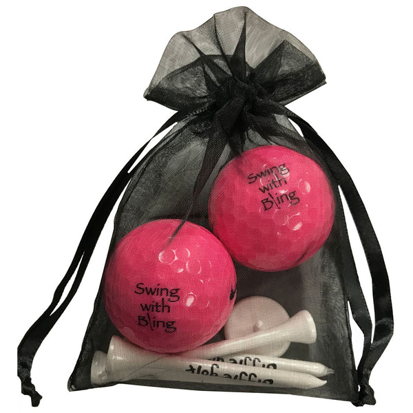 swing with bling pink golf balls with four wooden golf tees
