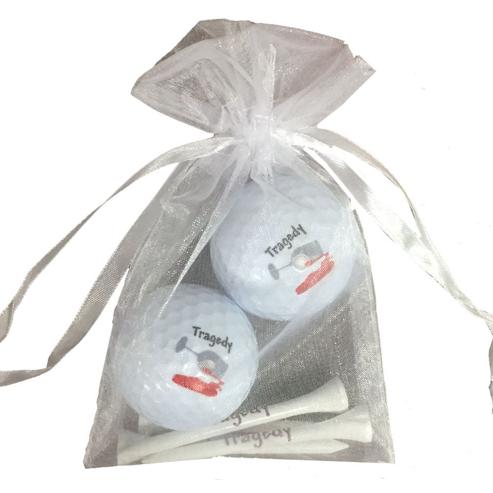 Tragedy golf ball and tees set. Great for tournaments. A playful gift for women golfers. Cute Packaging. Shop now! Cheers.