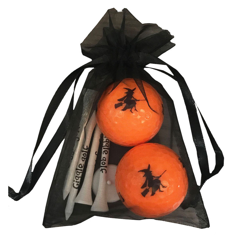 nWitch-themed golf ball and tee set featuring flying witch design on orange golf balls. Ideal for Trick or Treat Tournament.