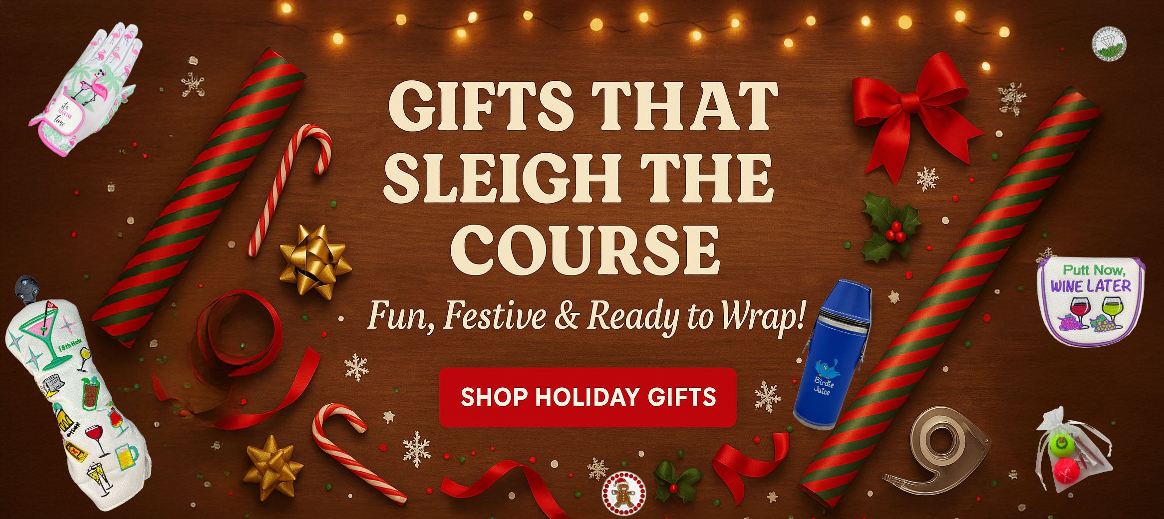 Holiday golf gift banner with festive decorations, golf accessories, and the message “Gifts That Sleigh the Course.”