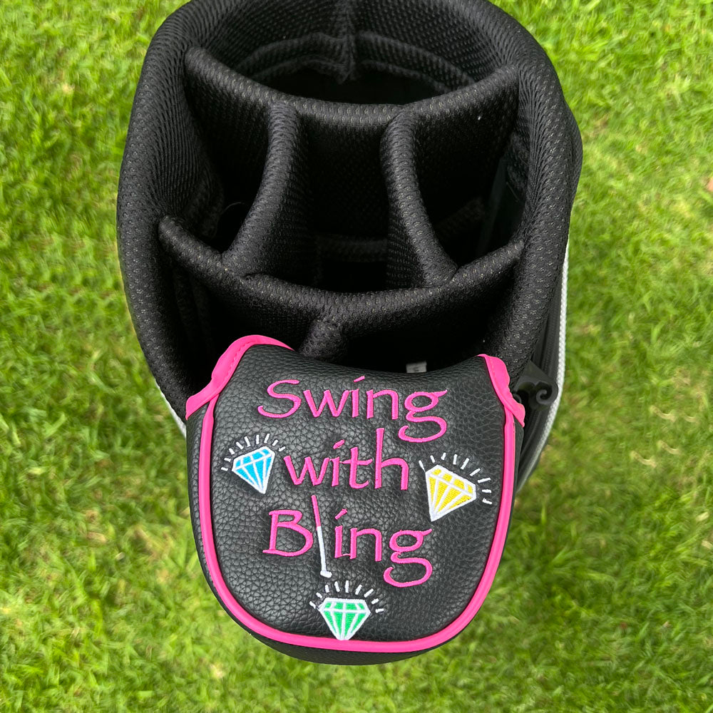 Black golf club head cover with 'Swing with Bling' text and gemstone designs on a grass background