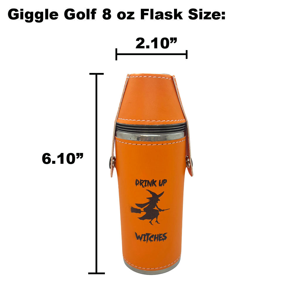 An orange cylindrical golf flask with a witch graphic and the words 'DRINK UP WITCHES' on the front, shown with dimension lines and text indicating 6.10 inches tall and 2.10 inches wide