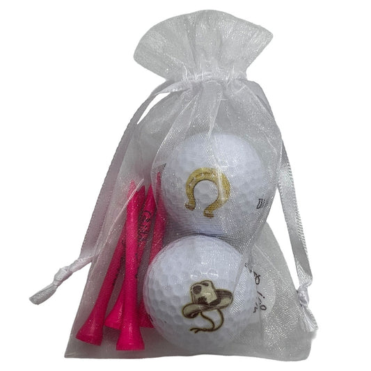 Western golf ball and tees set featuring western-themed design. Includes 2 golf balls and 4 pink tees, perfect for women golfers