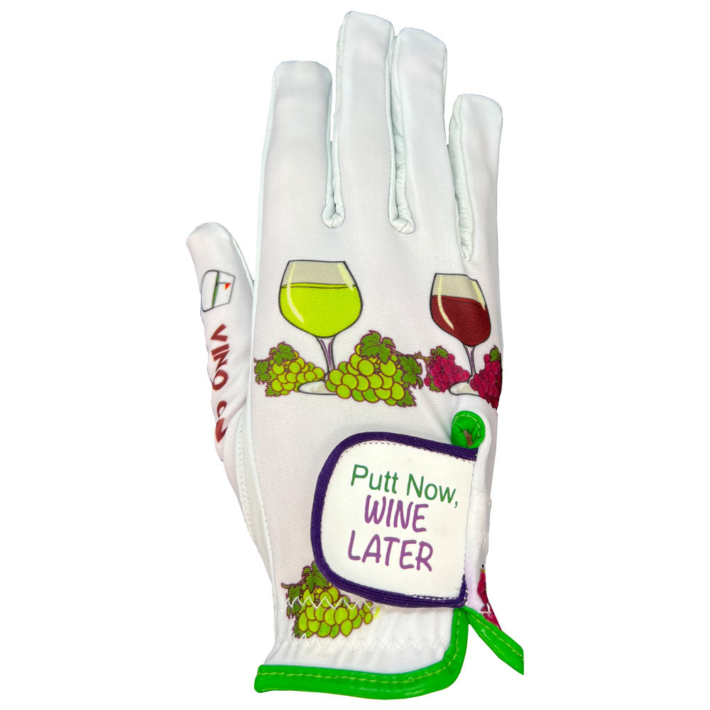 White golfing glove with wine-themed design and text 'Putt Now, Wine Later' on a white background. Worn on right hand.