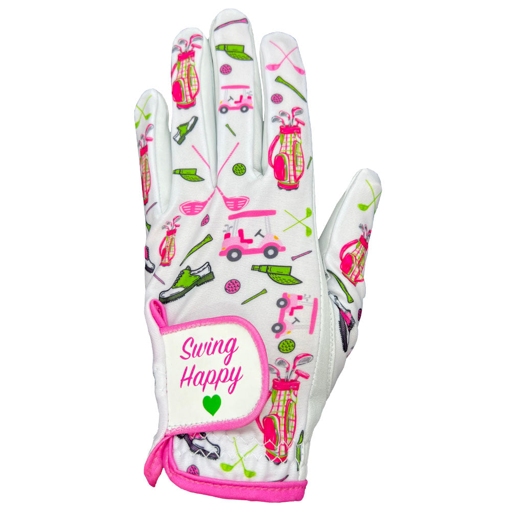 Women’s Swing Happy golf glove showing pink and green golf cart, bag, and shoe pattern with a "Swing Happy" adjustable velcro strap.