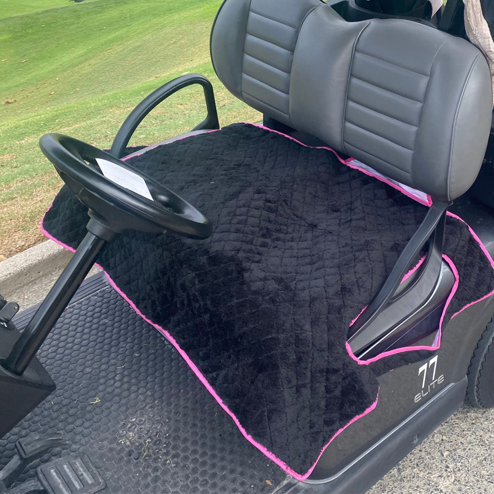 Reversible soft black fleece side of the golf cart seat blanket installed on a cart.