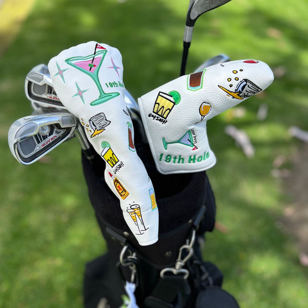 The Giggle Golf 19th Hole Utility Head Cover & Blade Putter Cover on the golf course.