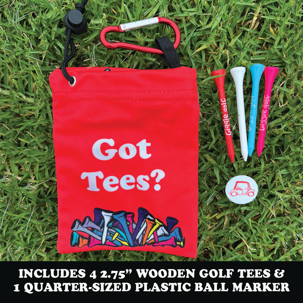 Red bag labeled 'Got Tees?' with colorful golf tees and a ball marker on grass