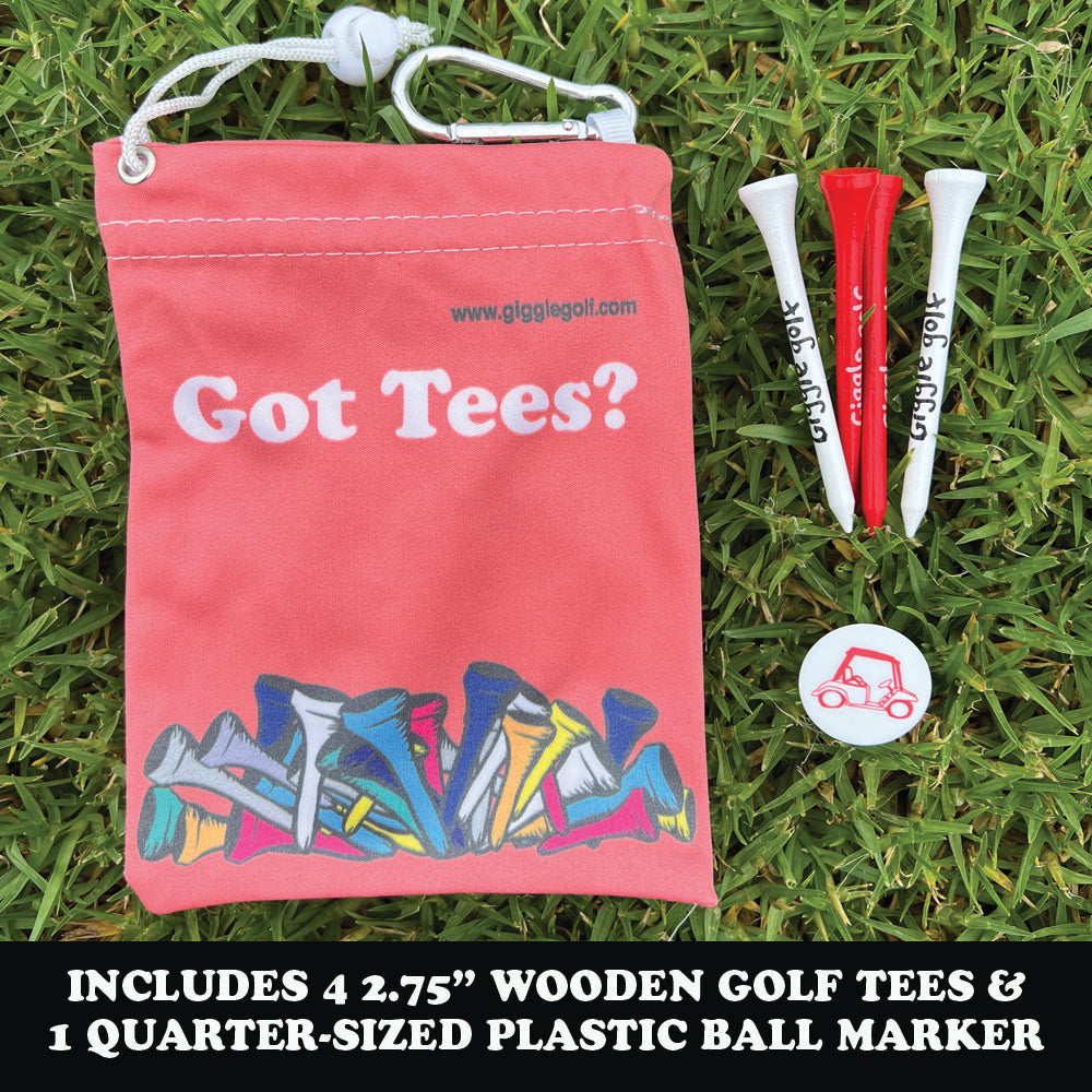Light red bag labeled 'Got Tees?' with golf tees and a ball marker on grass.