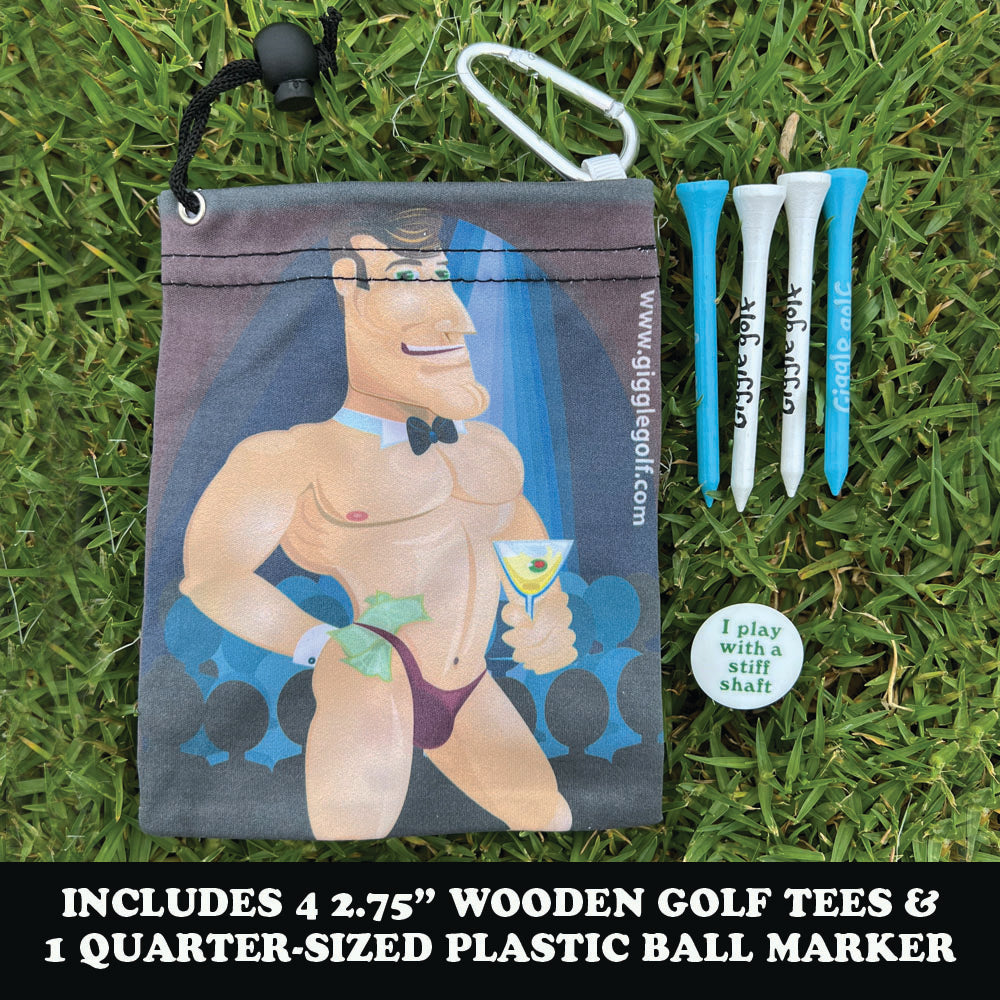Golf accessories including a drawstring bag with a male stripper, golf tees, and a ball marker on grass.