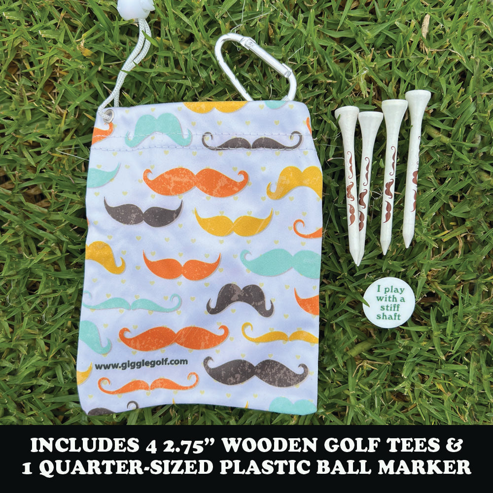 Golf tees and ball marker set with mustache patterned tee bag on grass