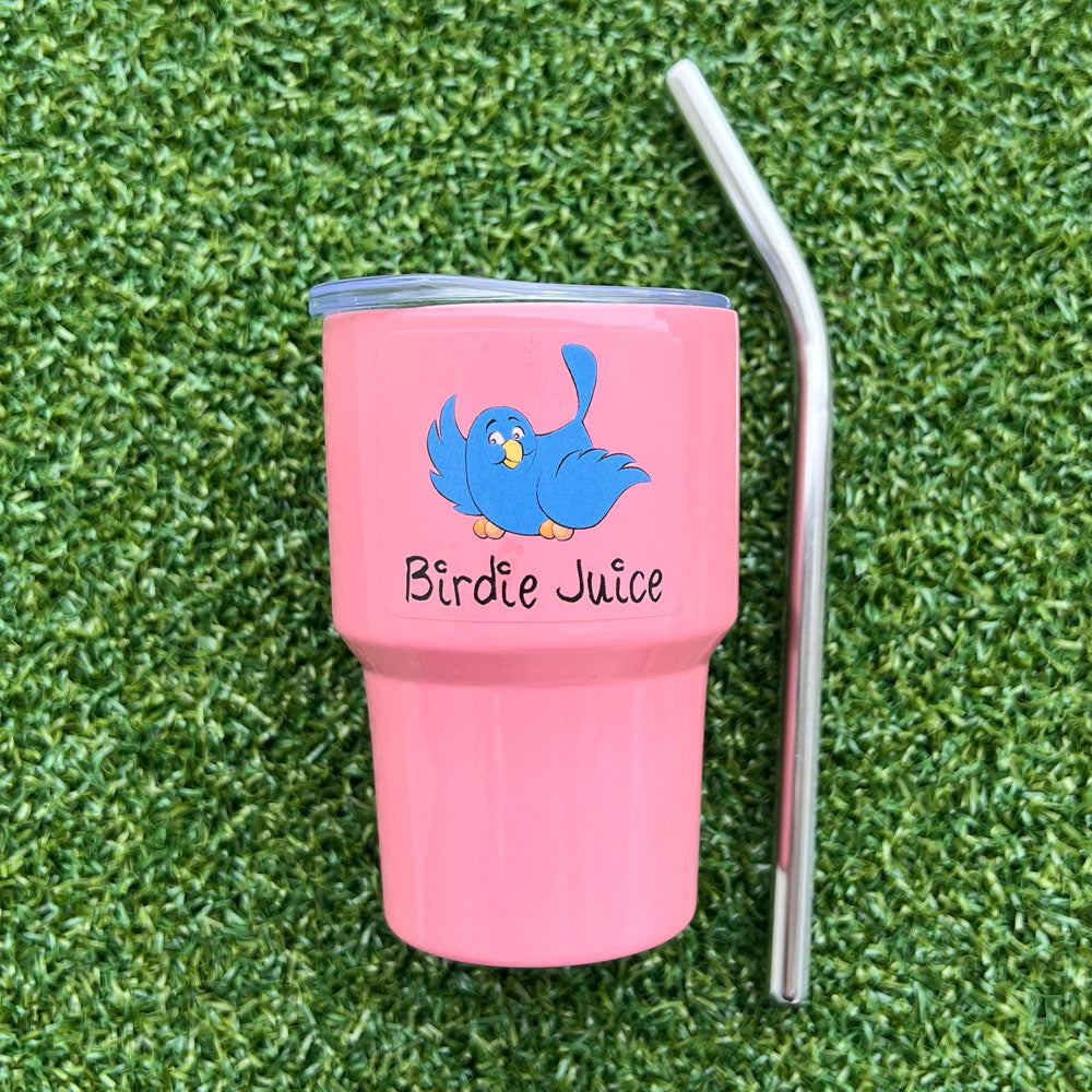 Pink golf mini tumbler with blue bird design and 'Birdie Juice' text on grass - pastel set