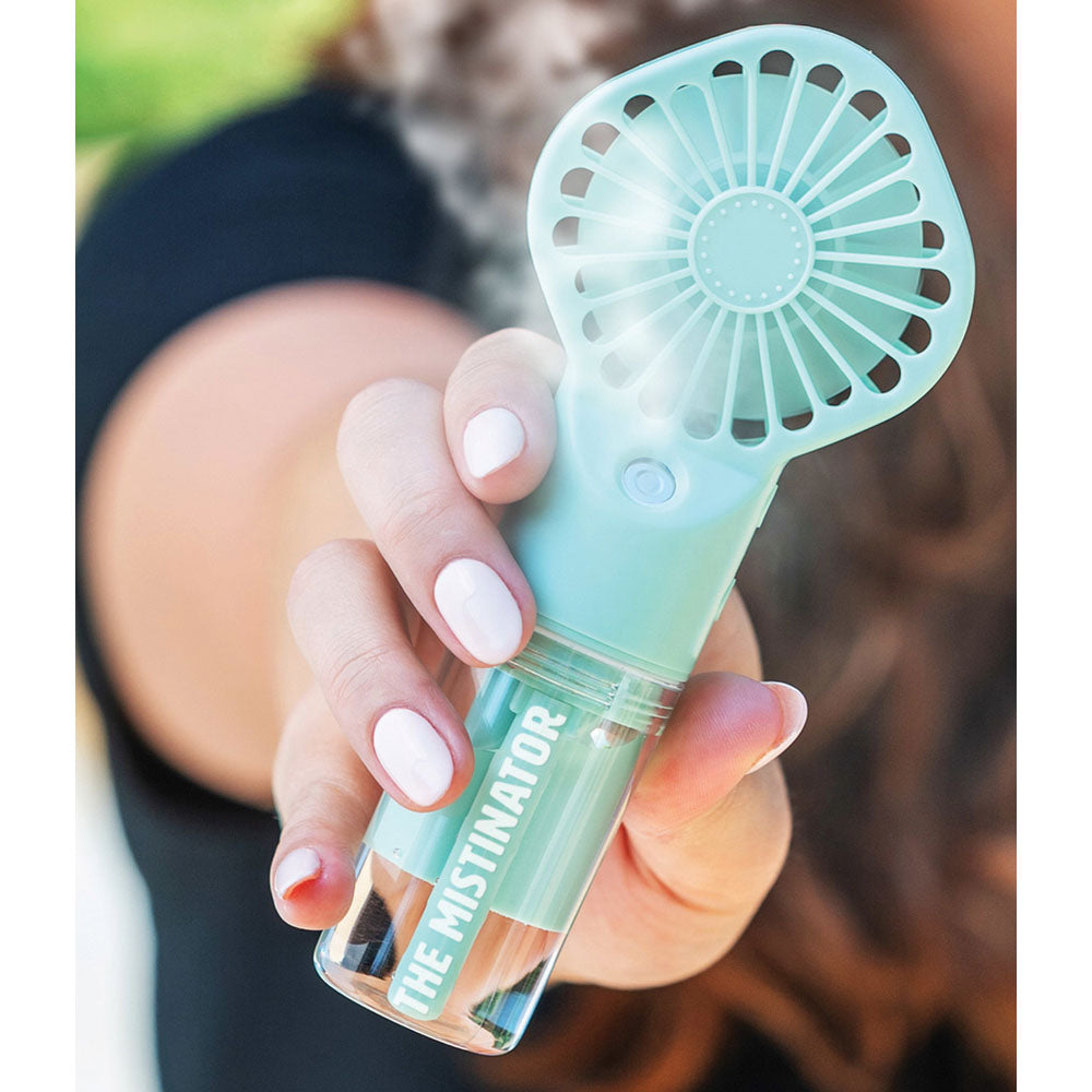 The Mistinator Rechargeable Water Fan - Mint Green Being Held In Hand