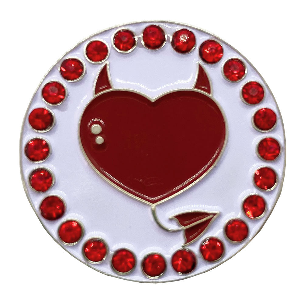 golf ball marker with a red heart with a devil design on a white background