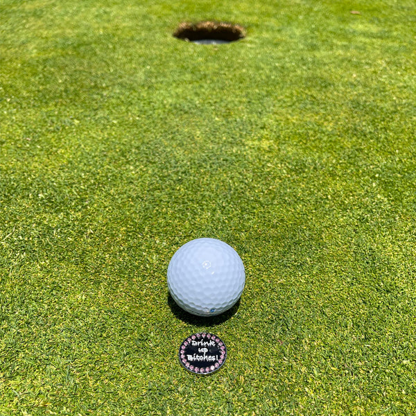 Giggle Golf Bling Drink Up Bitches On A Putting Green, Behind A White Golf Ball