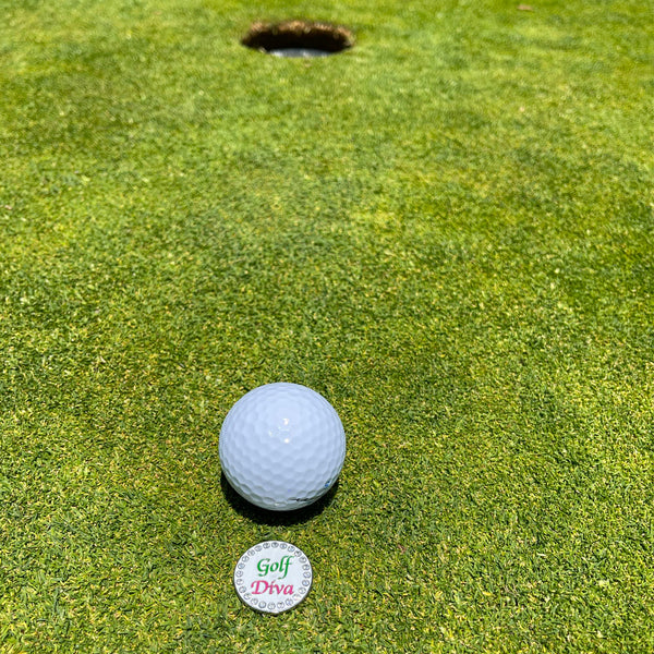 Giggle Golf Bling Golf Diva Ball Marker On A Putting Green, Behind A White Golf Ball