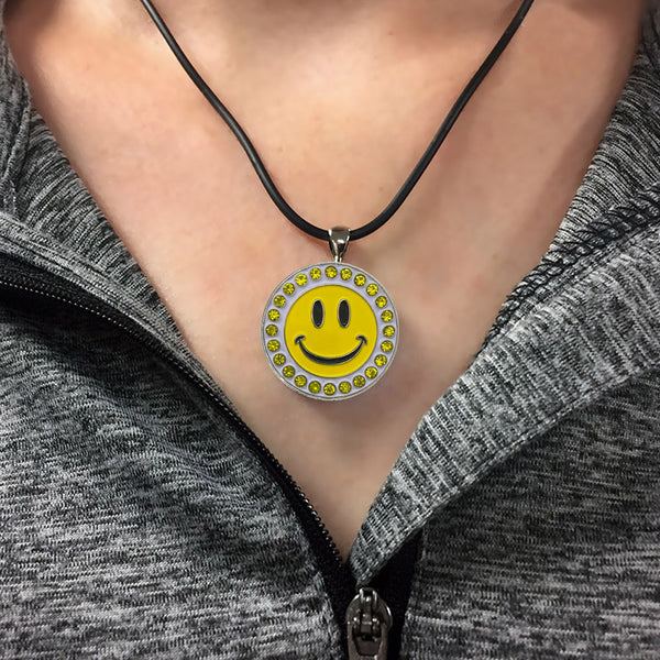 A Woman Wearing The Giggle Golf Bling Happy Face Ball Marker Necklace