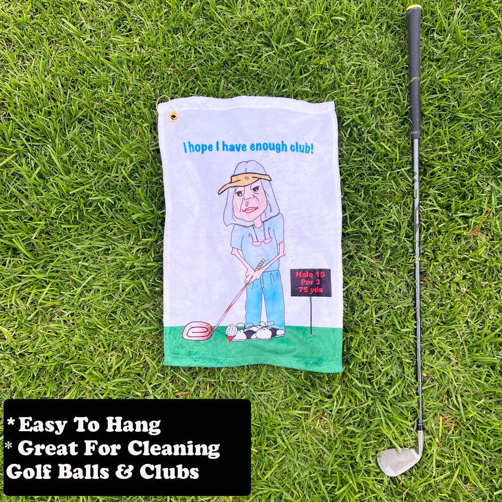 Golf towel with female cartoon golfer and golf club on grass