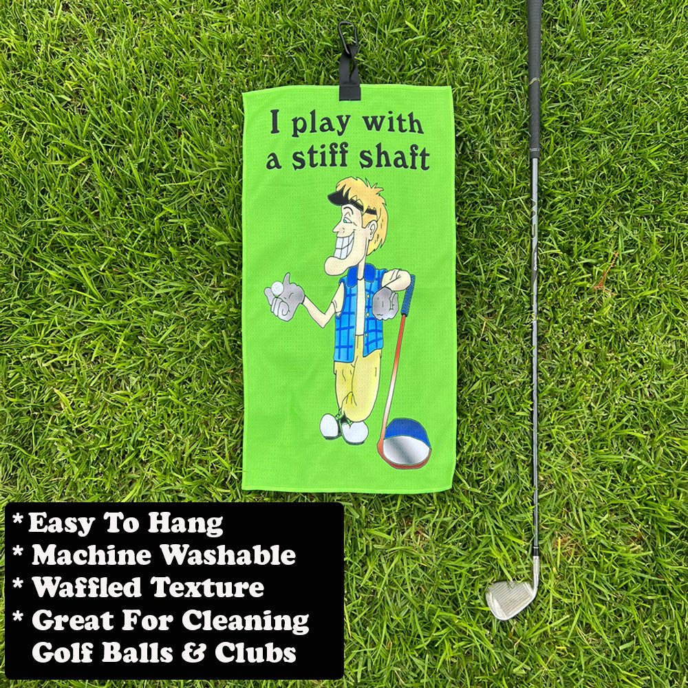 Golf towel with a funny cartoon male golfer and text on grass with golf club