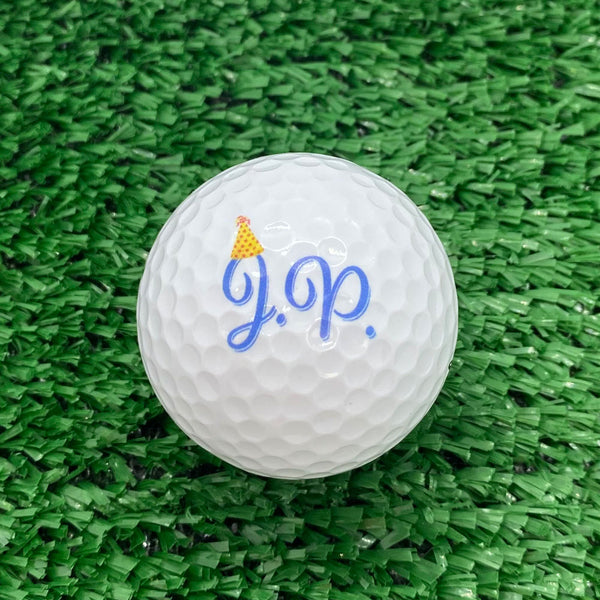 example of golf ball with birthday party hat on initials
