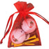 chili pepper golf balls with yellow wooden golf tees