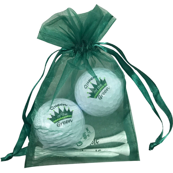 green croqn queen of the green golf balls with four golf tees