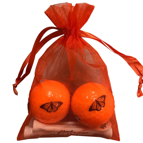 orange butterfly golf balls with wooden golf tees