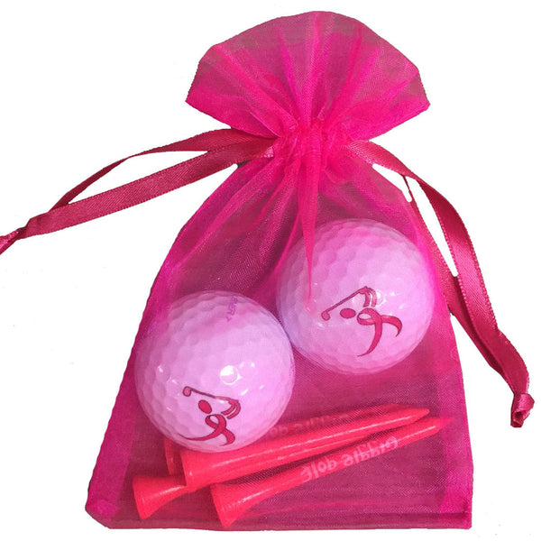 pink ribbon golfer golf balls with four wooden golf tees