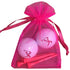pink ribbon golfer golf balls with four wooden golf tees