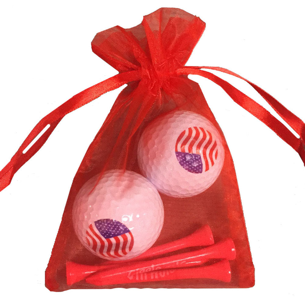 USA Flag golf ball and tees set featuring a bold patriotic design. Includes 2 golf balls and 4 tees, ideal for women golfers.