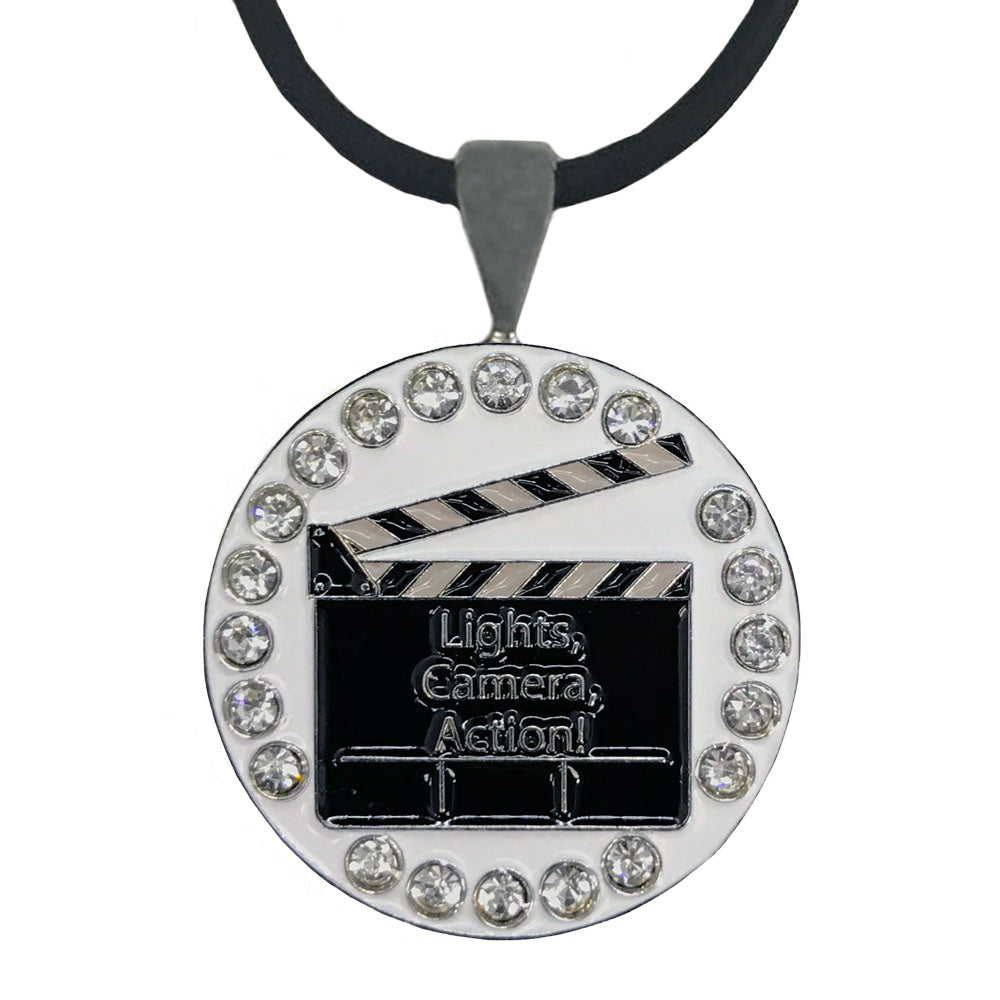 
Clapboard golf ball marker necklace with crystal accents, white background. An Oscar worthy design for women golfers 
