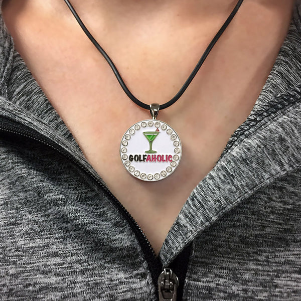 a woman wearing a bling golfaholic (martini) golf ball marker necklace