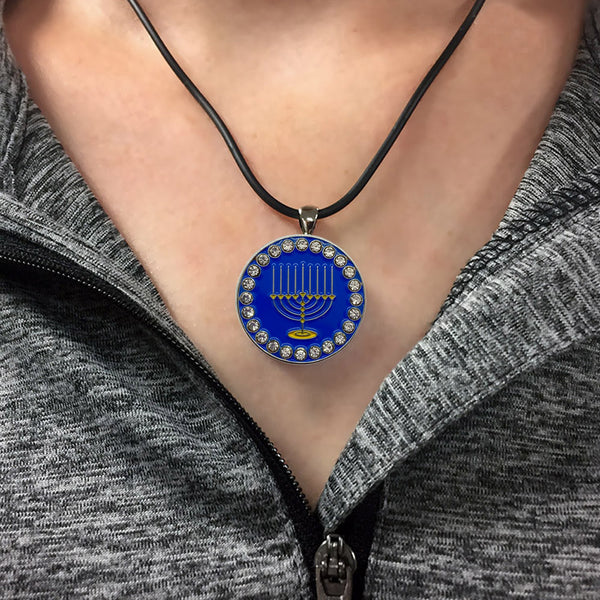 Example of bling menorah golf ball marker necklace on a woman.
