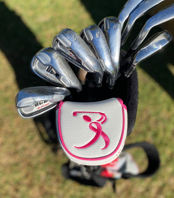 giggle golf pink ribbon (breast cancer awareness) mallet on a putter in a golf bag